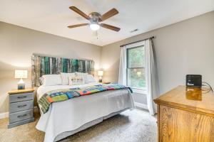 a bedroom with a bed and a ceiling fan at Lakefront Boating Getaway in Spring City! in Spring City
