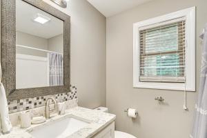 a white bathroom with a sink and a mirror at Lakefront Boating Getaway in Spring City! in Spring City +21 photos
