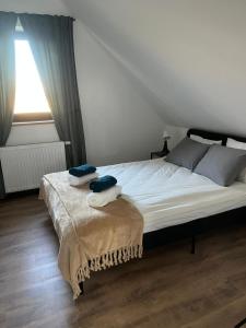Postel nebo postele na pokoji v ubytování Wigierska Piertówka