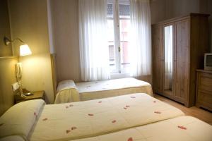 Postel nebo postele na pokoji v ubytování Hostal Orejas
