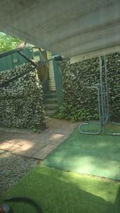 a building with a stone wall and a stairway at Grateful Hemphill B in Atlanta +2 photos