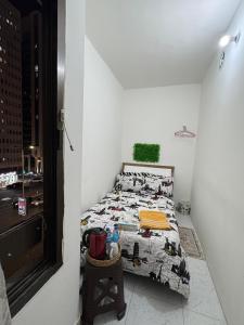 a bedroom with a bed with a comforter with animals on it at Abel homes in Abu Dhabi