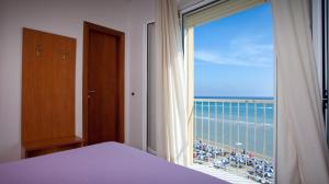 Postel nebo postele na pokoji v ubytování Hotel Florence