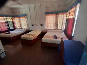 Postel nebo postele na pokoji v ubytování Tavua Hotel Ismail Investments