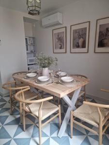 a dining room table and chairs with a table and chairs at La Posada del Olivar in Baena +50 photos