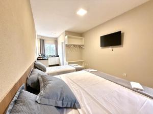 Your Home - Studios Boutique Hotel客房内的一张或多张床位