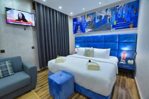 Postel nebo postele na pokoji v ubytování Hotel Dar Annasr
