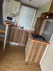 Kuchyň nebo kuchyňský kout v ubytování Mobil home au castellas marseillan
