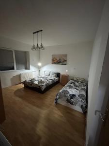 Ένα ή περισσότερα κρεβάτια σε δωμάτιο στο Elena Apartment 2