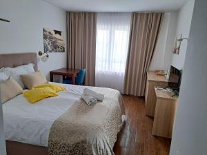 Postel nebo postele na pokoji v ubytování Villa Cascada
