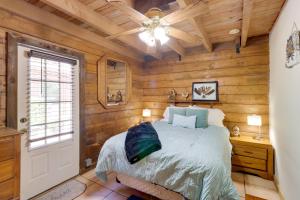 a bedroom with wooden walls and a bed and a ceiling at Cabin with Boat Launch and Pool Access in Okeechobee in Okeechobee