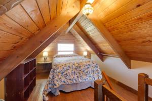 a bedroom with a bed in a attic at Cabin with Boat Launch and Pool Access in Okeechobee in Okeechobee