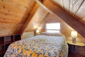 a bedroom in a log cabin with a bed at Cabin with Boat Launch and Pool Access in Okeechobee in Okeechobee