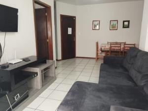 تلفاز و/أو أجهزة ترفيهية في Apartamento de Praia no Centro