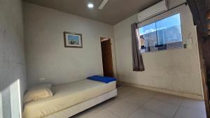 Rúm í herbergi á Hostal Fontana Di Luque