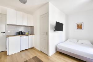 Kuchyňa alebo kuchynka v ubytovaní Résidence Paris Ivry House