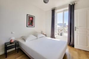 Posteľ alebo postele v izbe v ubytovaní Résidence Paris Ivry House