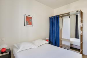 Posteľ alebo postele v izbe v ubytovaní Résidence Paris Ivry House