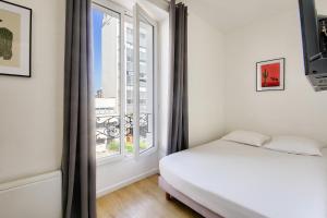 Posteľ alebo postele v izbe v ubytovaní Résidence Paris Ivry House