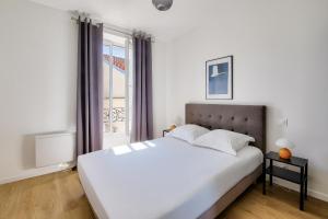 Posteľ alebo postele v izbe v ubytovaní Résidence Paris Ivry House