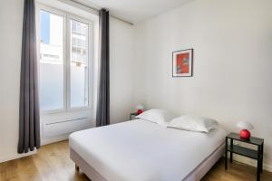 Posteľ alebo postele v izbe v ubytovaní Résidence Paris Ivry House