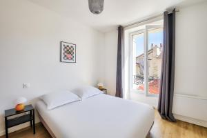 Posteľ alebo postele v izbe v ubytovaní Résidence Paris Ivry House