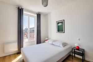 Posteľ alebo postele v izbe v ubytovaní Résidence Paris Ivry House
