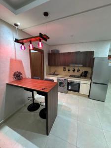 Køkken eller tekøkken på Cosy appart hotel Bouznika