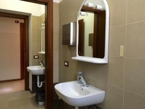 a bathroom with a sink and a mirror at L'Archetto in Cremona +53 photos