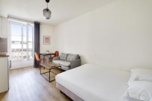 Posteľ alebo postele v izbe v ubytovaní Résidence Paris Ivry House