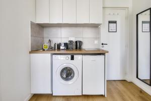 Kuchyňa alebo kuchynka v ubytovaní Résidence Paris Ivry House