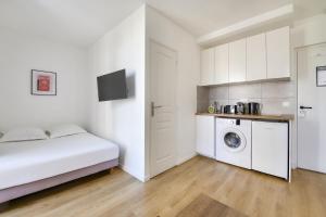 Kuchyňa alebo kuchynka v ubytovaní Résidence Paris Ivry House