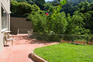 A garden outside Rio Boutique Suites