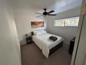 a bedroom with a bed with a ceiling fan at COH0957 - Bella Ari home in South Lake Tahoe