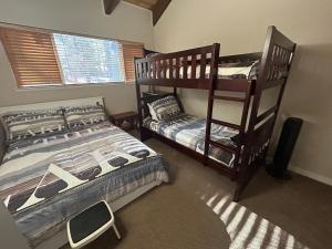 a bedroom with two bunk beds and a window at HCC0410 - Heavenly Hideaway in South Lake Tahoe