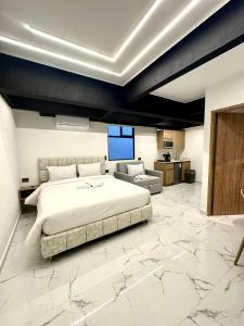 a bedroom with a large bed and a living room at Foret Lofts in Medellín +64 photos
