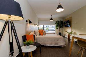 Кровать или кровати в номере Rivadavia Apartamentos