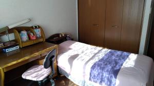 Postel nebo postele na pokoji v ubytování OSO Homestay