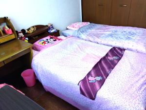 Postel nebo postele na pokoji v ubytování OSO Homestay