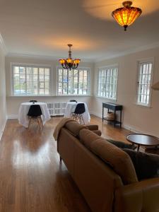 a living room with a couch and two tables at The Ambassador in Ottawa