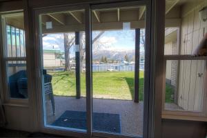 an open glass door with a view of a yard at TKC0604 - Betty Ann's Place condo in South Lake Tahoe