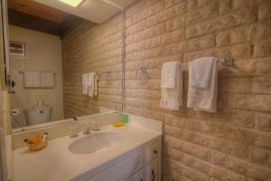 a bathroom with a sink and a mirror and towels at TKC0604 - Betty Ann's Place condo in South Lake Tahoe +13 photos