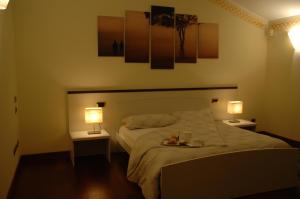 Postel nebo postele na pokoji v ubytování B&B Nelly