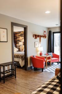 a hotel room with a bed and a mirror at Erin Hills Area Perfect Retreat in Rubicon