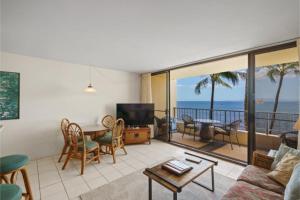 a living room with a view of the ocean at SUGAR BEACH RESORT, #430^ condo in Kihei