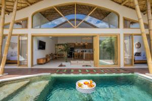 a villa with a swimming pool with a house at M&M Dream Villa - 2 BR Villa in Kerobokan in Kerobokan