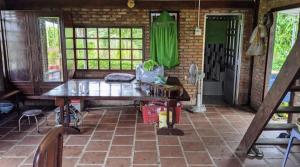 a room with a table and some windows at LOOP Farm in Xã Tầm Hưng (1)