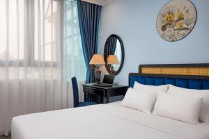 Giường trong phòng chung tại Mai Charming Hotel and Spa