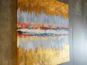 a painting is hanging on a wall at KIYOMORI in Hatsukaichi