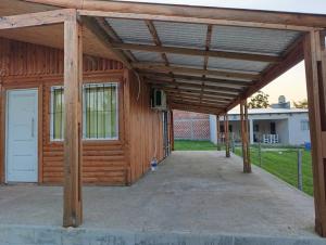 a wooden pavilion with a white garage door at Dulce Morena in Concordia